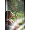 Mid-aged woman lighting a cigarette at home, getting her nicotine daily dose, unable to resist to her unhealthy habit