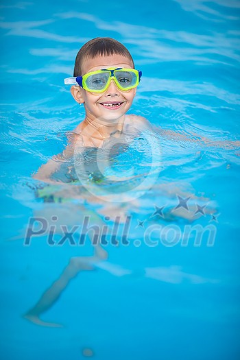 Cute little boy in a swimming pool Cute little boy in a swimming pool
