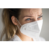 Young woman wearing a face mask during coronavirus and flu outbreak. Virus and illness protection, home quarantine. COVID-19 concept