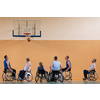 Disabled War veterans mixed race opposing basketball teams in wheelchairs photographed in action while playing an important match in a modern hall. High quality photo