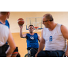 handicapped war veterans in wheelchairs with professional equipment play basketball matches in the hall. the concept of sports with disabilities. High quality photo