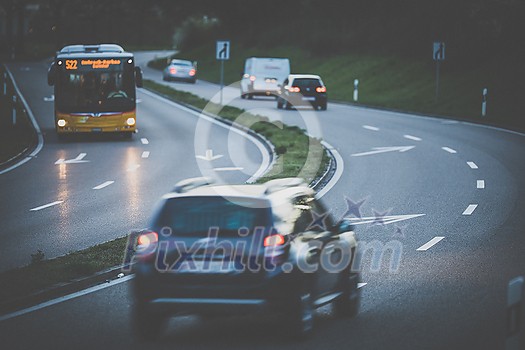Cars on a highway at sunset (shallow DOF; color toned image) Cars on a highway at sunset (shallow DOF; color toned image)