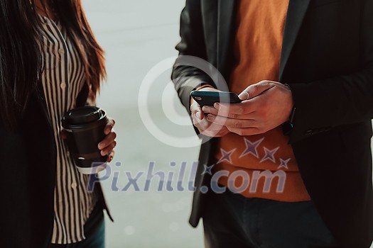 macro photo of young people using the phone during a break from work