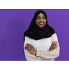 portrait of african muslim woman wearing hijab and traditional muslim clothes with cross hand posing in front of purple background

