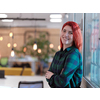 redhead business woman portrait as influencer in creative modern coworking startup open space office