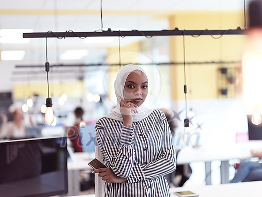 african americam modern muslim businesswoman portrait wearing hijab at creative modern startup coworking open space office