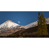 Colorful scenic landscape of moon rise in Tenerife national park of Teide. El Teide with moon rising by its side.