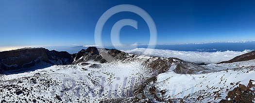 Peaks of Teide and Pico Viejo volcanoes at sunset seen from the Samara crater. Teide National Park, Tenerife, Canary Islands, Spain