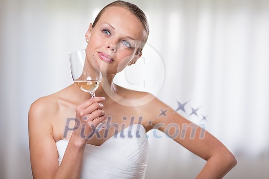 Lovely bride with a glass of white wine