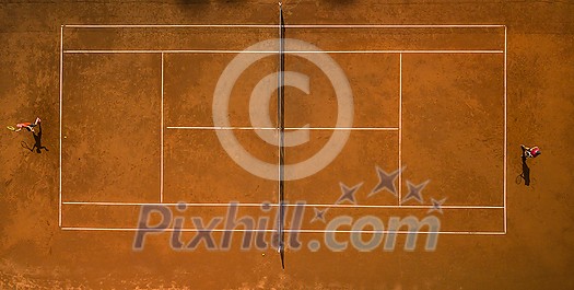 Tennis players on the court. Wide angle view from above with plenty of copyspace