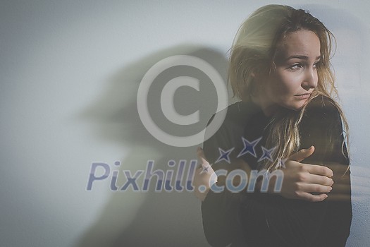 Depressed mid-aged woman at home feeling sad, lonely, anxious (color toned image) Depressed mid-aged woman at home feeling sad, lonely, anxious (color toned image)