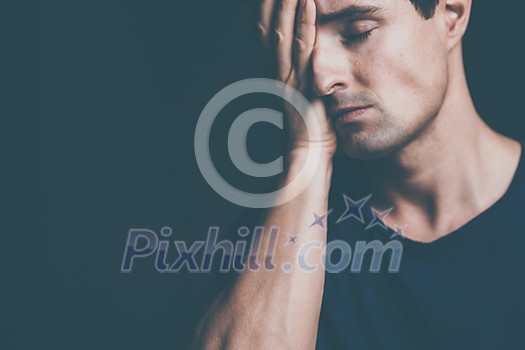 Young man suffering from anxiety, depression due to social seclusion, isolation, COVID induced lockdown Young man suffering from anxiety, depression due to social seclusion, isolation, COVID induced lockdown