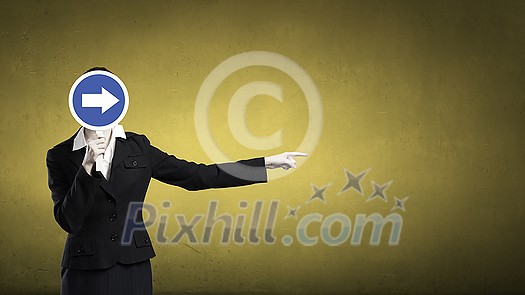 Unrecognizable businesswoman hiding her face behind mask and showing direction Unrecognizable businesswoman hiding her face behind mask and showing direction