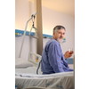 Senior male patient in a modern hospital (shallow DOF; color toned image)