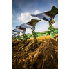 Tractors working on a farm field, - agricultural machines at work