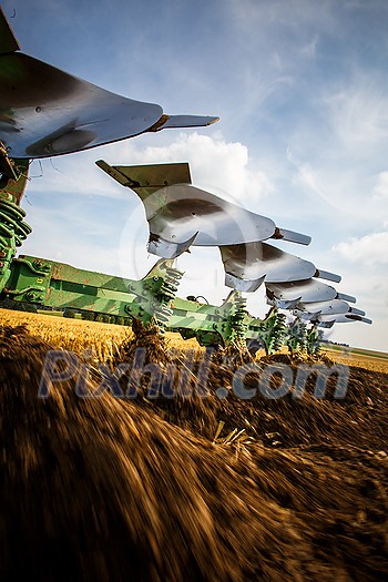 Tractor working on the farm, modern agricultural transport, farmer working in the field, tractor on a sunset background, cultivation of land, agricultural machine Tractor working on the farm, modern agricultural transport, farmer working in the field, tractor on a sunset background, cultivation of land, agricultural machine