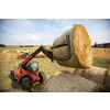 Tractors working on a farm field, - agricultural machines at work