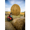 Tractors working on a farm field, - agricultural machines at work