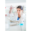 Young, female researcher carrying out experiments in a lab (shallow DOF; color toned image)