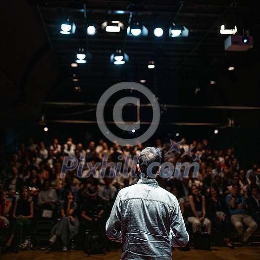 Speaker giving a talk on corporate Business Conference. Audience at the conference hall. Business and Entrepreneurship event. Speaker giving a talk on corporate Business Conference. Audience at the conference hall. Business and Entrepreneurship event.
