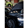 Tyre change - wheel balancing or repair and change car tire at auto service garage or workshop by mechanic