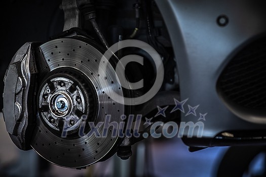 Tyre change - wheel balancing or repair and change car tire at auto service garage or workshop by mechanic Tyre change - wheel balancing or repair and change car tire at auto service garage or workshop by mechanic