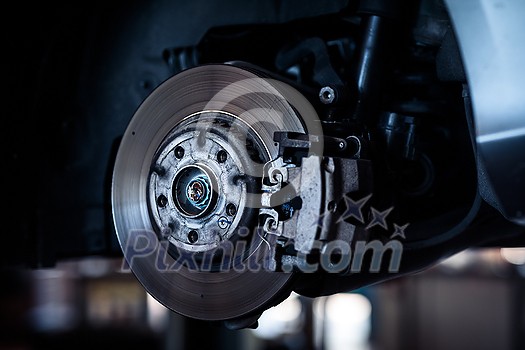 Tyre change - wheel balancing or repair and change car tire at auto service garage or workshop by mechanic Tyre change - wheel balancing or repair and change car tire at auto service garage or workshop by mechanic