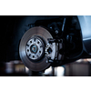 Tyre change - wheel balancing or repair and change car tire at auto service garage or workshop by mechanic