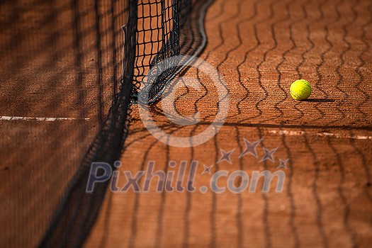 Tennis court with tennis balls and the net