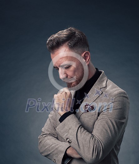 Frustrated middle aged elegant man Close up face of a stressed businessman wearing a stylish suit with eyes closed. Side shot