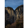 High waterfall within alpine scenery in Switzerland