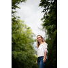 Portrait of a relaxed middle aged woman outdoors, looking happy, enjoying the life