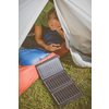 Cell phone charging with a solar charger in a tent during an outdoor trip