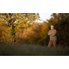 Portrait of handsome senior man in the autumn outdoors. Active senioor enjoying his retirement in the  nature