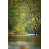 Fly fisherman fly fishing on a splendid mountain river