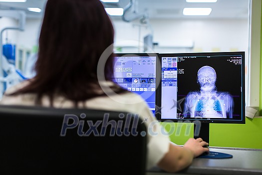 Patient undergoing a Computed tomography (CT) scanning (color toned image, shallow DOF)