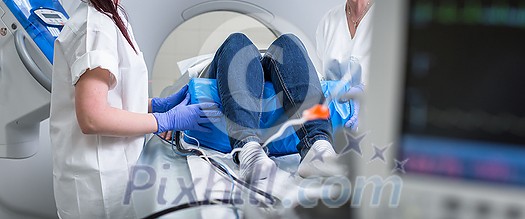 Patient undergoing a Computed tomography (CT) scanning (color toned image, shallow DOF) Patient undergoing a Computed tomography (CT) scanning (color toned image, shallow DOF)