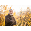 Happy senior man enjoying a lovele autumn day outdoors