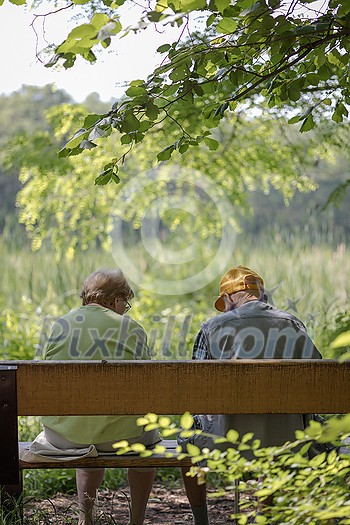 Elderly couple outdoors in summer. Happy elderly couple on a walk. Handsome man and woman senior citizens. Husband and wife of old age against the background of nature. Elderly couple outdoors in summer. Happy elderly couple on a walk. Handsome man and woman senior citizens. Husband and wife of old age against the background of nature.