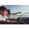 Father and son enjoy their vacation together while riding a luxury boat at sea. Selective focus. High-quality photo