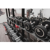 Closeup of kilogram dumbbells placed on a dumbbell rack at the gym. Weight training equipment. High-quality photo