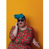 Trendy plus size woman having conversation talking by smartphone over yellow background smiling with an idea or question pointing finger with happy face, number one. High quality photo