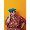 Trendy plus size woman having conversation talking by smartphone over yellow background smiling with an idea or question pointing finger with happy face, number one. High quality photo