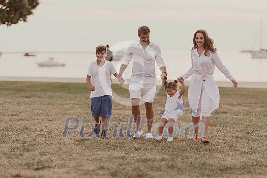 Senior couple in casual clothes with their children, boy and girl enjoy the beach spending a vacation together. Family time. Selective focus. High-quality photo