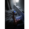 Middle-aged woman using her tablet computer before sleep in bed in the evening - exposure to blue light right before sleep