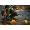 Close-up view of the hands of a fly fisherman holding a lovely trout while  fly fishing on a splendid mountain river