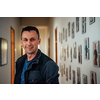 a portrait of a man in a work suit standing in the hallway of a factory. High quality photo