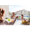 The senior couple and their son eating a healthy breakfast together early in the morning in a luxury house. Selective focus. High-quality photo