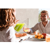 Senior couple eating a healthy breakfast together early in the morning in a luxury house. Selective focus. High-quality photo