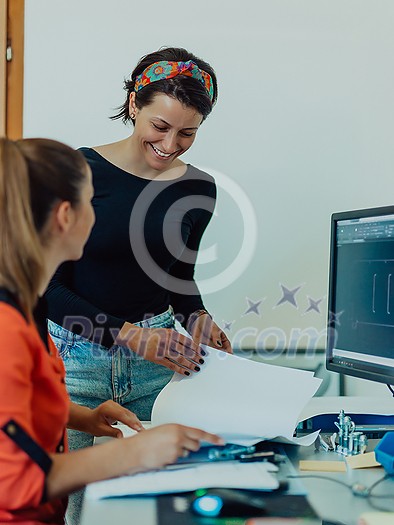 Within the heavy industry, a factory industrial engineer measures with a caliper and on a personal computer Designs a 3D model. High quality photo